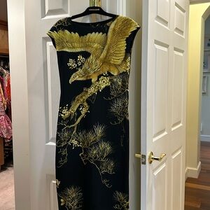 Roberto Cavalli size42 black with yellow print. Midi length 41”